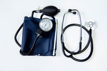 medicine, stethoscope, sphygmomanometer, paper, pen