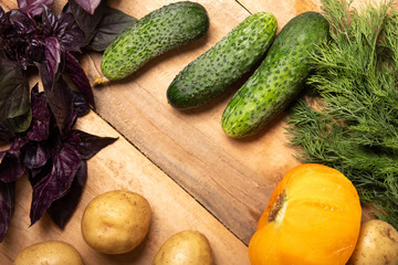 Vegetables on wood, healthy food, herbs and spices.