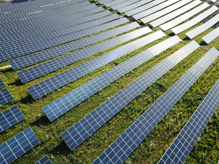 Aerial view of a solar farm producing clean renewable sun energy, industrial landscape