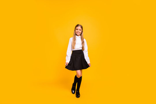 Full length body size view of her she nice-looking attractive sweet winsome modern cheerful cheery straight-haired pre-teen girl posing isolated over bright vivid shine yellow background