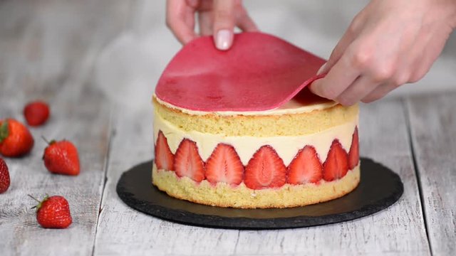 Strawberry Fraisier Cake. Pastry chef put marzipan on the cake.