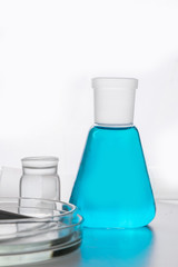 Chemistry flask with blue liquid for science research and experiment.