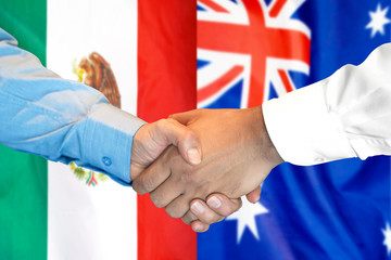 Business handshake on the background of two flags. Men handshake on the background of the Mexico and Australia flag. Support concept
