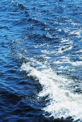 Fototapeta na wymiar blue water with white wave