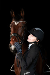 Fototapeta na wymiar Portrait einer Reiterin mit dem Pferd im Studio