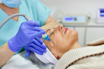 Woman receiving oxygen facial treatment