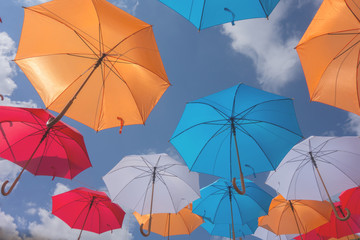 Fototapeta na wymiar Rows of Color Umbrellas in the Air