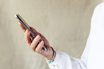 Close up of woman hand with smartphone