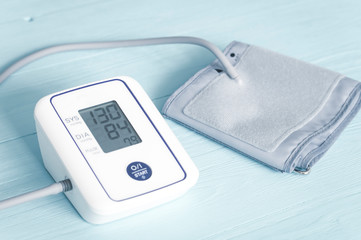 blood pressure monitor, tinted image, selective focus, wooden background