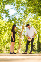 Obraz premium Portrait of a young couple in love enjoying in a city park