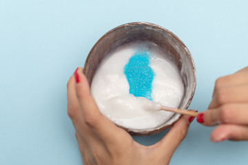 a girl making slime herself