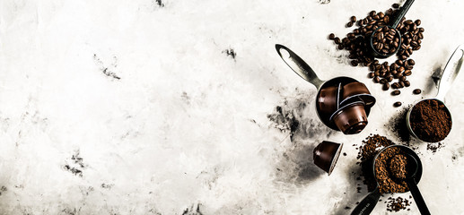 Coffee concept - beans, ground, instant, capsules marble background top view