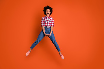 Full body photo of excited crazy jumping high lady yelling yeah unbelievable wear jeans denim pants...