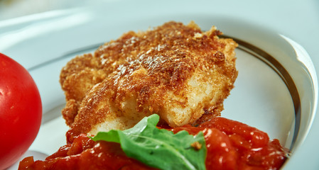 Fried cod with curry sauce and vegetables
