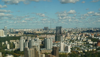 Fototapeta na wymiar View of Moscow cityscape, a mixture of buildings against the cloudy blue sky
