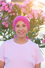 Woman with pink scarf on the head