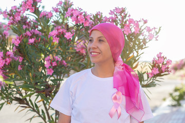Woman with pink scarf on the head