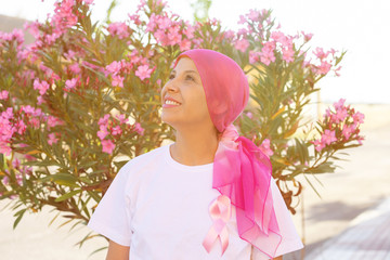 Woman with pink scarf on the head
