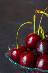 Close up of fresh cherry berries with water drops.