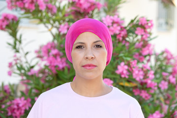 Woman with pink scarf on the head
