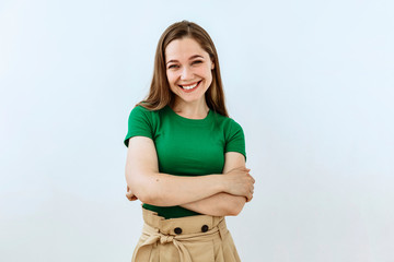 Cheerful girl portrait against white background. Laughter and joy emotions