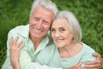 Beautiful senior couple posing in the park