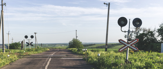 Old railway crossing in spring time