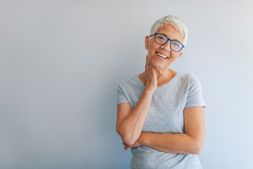 Woman headshot looking at camera. Portrait of beautiful mature woman. Portrait of businesswoman on...