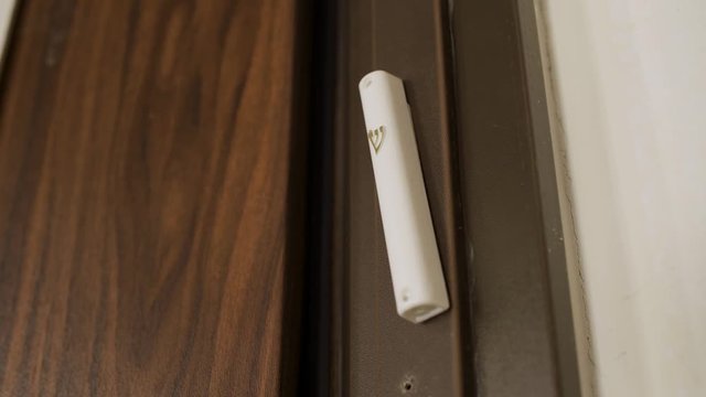 Jewish door placement called Mezuzah is touched by hand