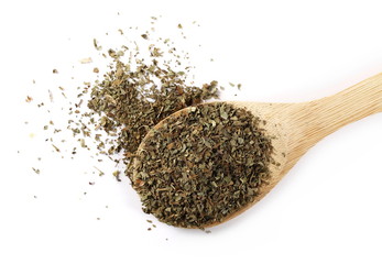 Basil dried spice in wooden spoon isolated on white background 