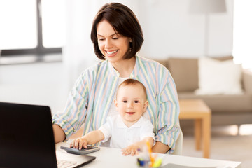 multi-tasking, freelance and motherhood concept - working mother baby boy and laptop computer at home office