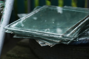 A pile of old float glass for recycling.