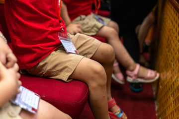 Closeup children sitting on seats in the theater watching the performance