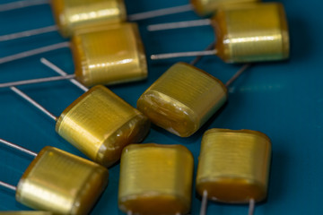 Electronic components, Lots of Polyester film capacitors on PCB background