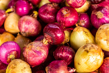 Red onions in unpeeled. Fresh vegetables for cooking. Organic food.