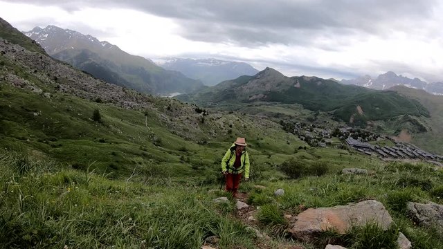 hiker woman with view of Tena Valley in The Pyrenees, Formigal,  Huesca, Spain