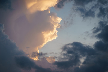 Cumulus clouds in the sunset sky.