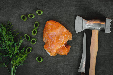 Slice of pickled turkey fillet on a kitchen cutting board background.