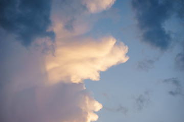 Fototapeta na wymiar Cumulus clouds in the sunset sky.