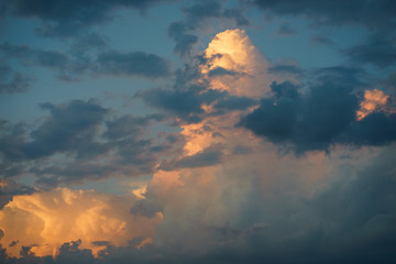 Cumulus clouds in the sunset sky.