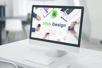 Computer display with web design text. concept of web design studio office.