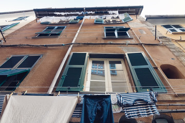 brown facade of houses in Portovenere in Italy in perspective