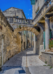 Old medieval stone buildings in the city of Uzes, in the Gard Department of France