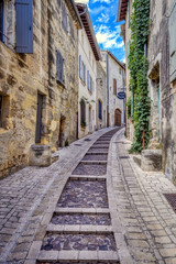 Old medieval stone buildings in the city of Uzes, in the Gard Department of France