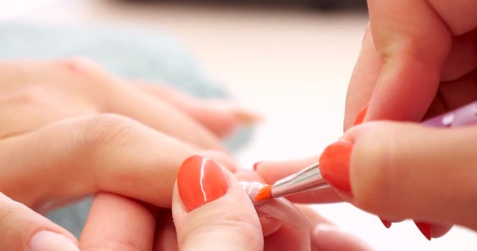 Close up of Beautician Applies Nail Polish in Beauty Manicure Salon