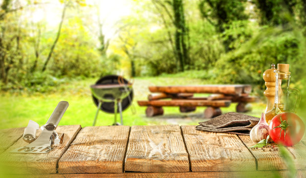 Wooden Old Table And Grill Party In Garden. 