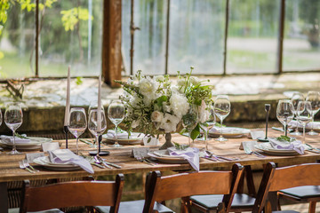 Wedding table decoration in wooden rustic style for a wedding.