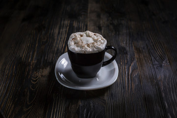 Cup of super awakening coffe latte or cappucino with milk and foam and cinnamon