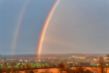 Fototapeta premium Beautiful Double Rainbow Over Countryside In Northwest Pennsylvania Venango Valley View