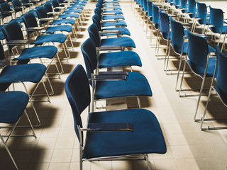 lecture hall empty with blue chairs